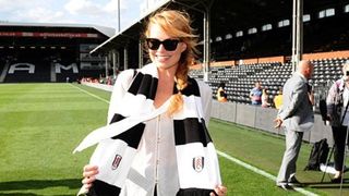 Margot Robbie picture wearing a Fulham scarf at a game in 2014.
