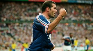 Zinedine Zidane of France celebrates after scoring his team's second goal during the 1998 FIFA World Cup final between France and Brazil at the Stade de France in Saint-Denis, Paris, France