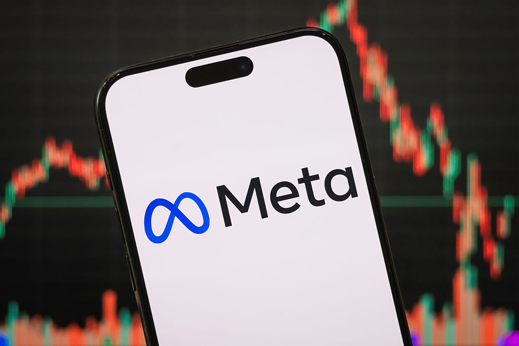 The logo of Meta Platforms, Inc. is displayed on a smartphone screen, with the company's latest stock market performance and candlestick chart visible in the background, reflecting investor sentiment and trading activity, on April 26, 2025