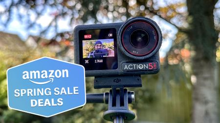 The DJI Osmo Action 5 Pro against a blurred background of trees and greenery, with a Tom's Guide Amazon Spring Sale badge in the lower left corner.