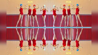 Photograph of female swimming team at a swimming pool, reflected in the water, by hasselblad Heroine Maria Svarbova
