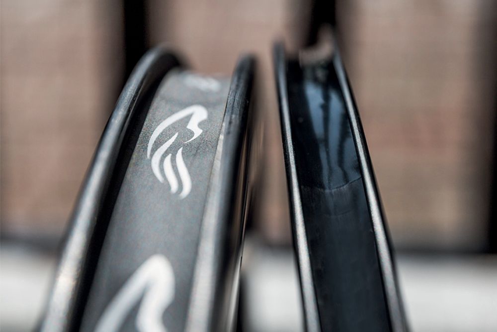 This image shows bike wheel rims , looking at the channel of two different sized wheels