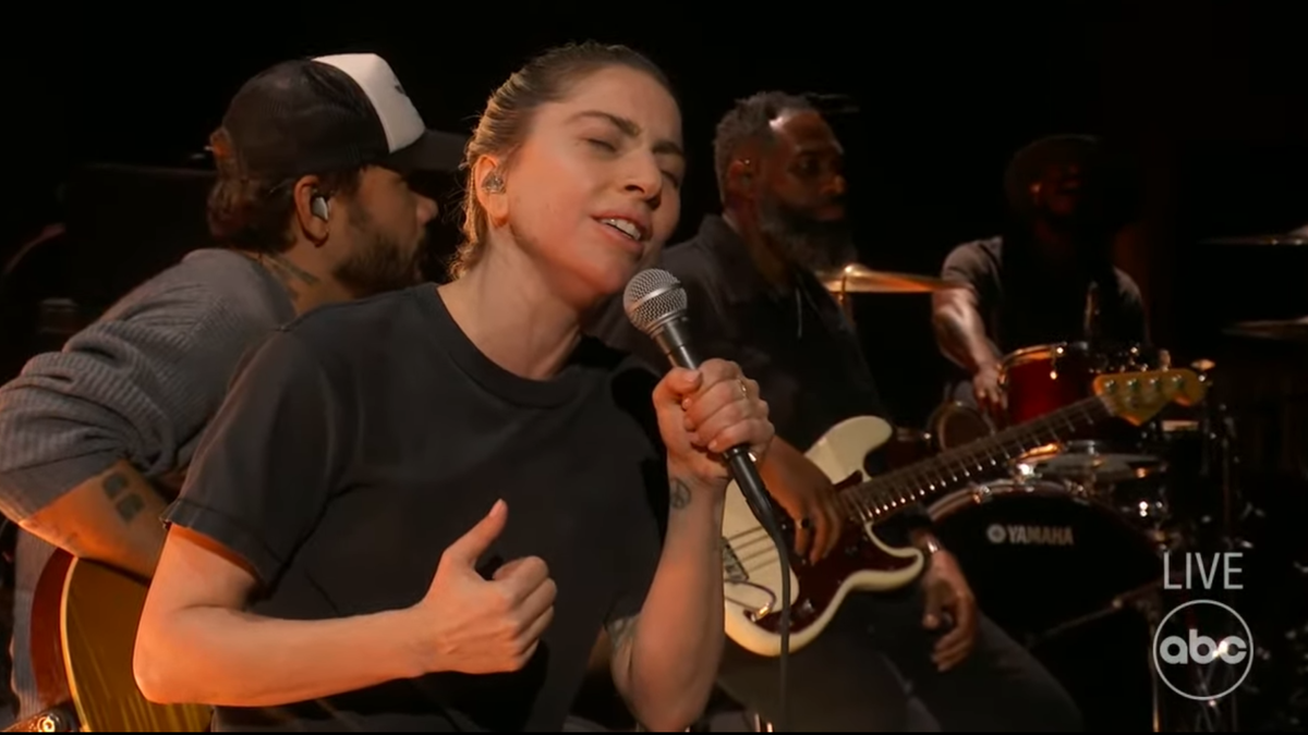Lady Gaga performing with her band on stage at the Oscars.