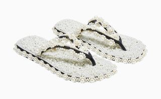A pair of flip-flops customised with pearls