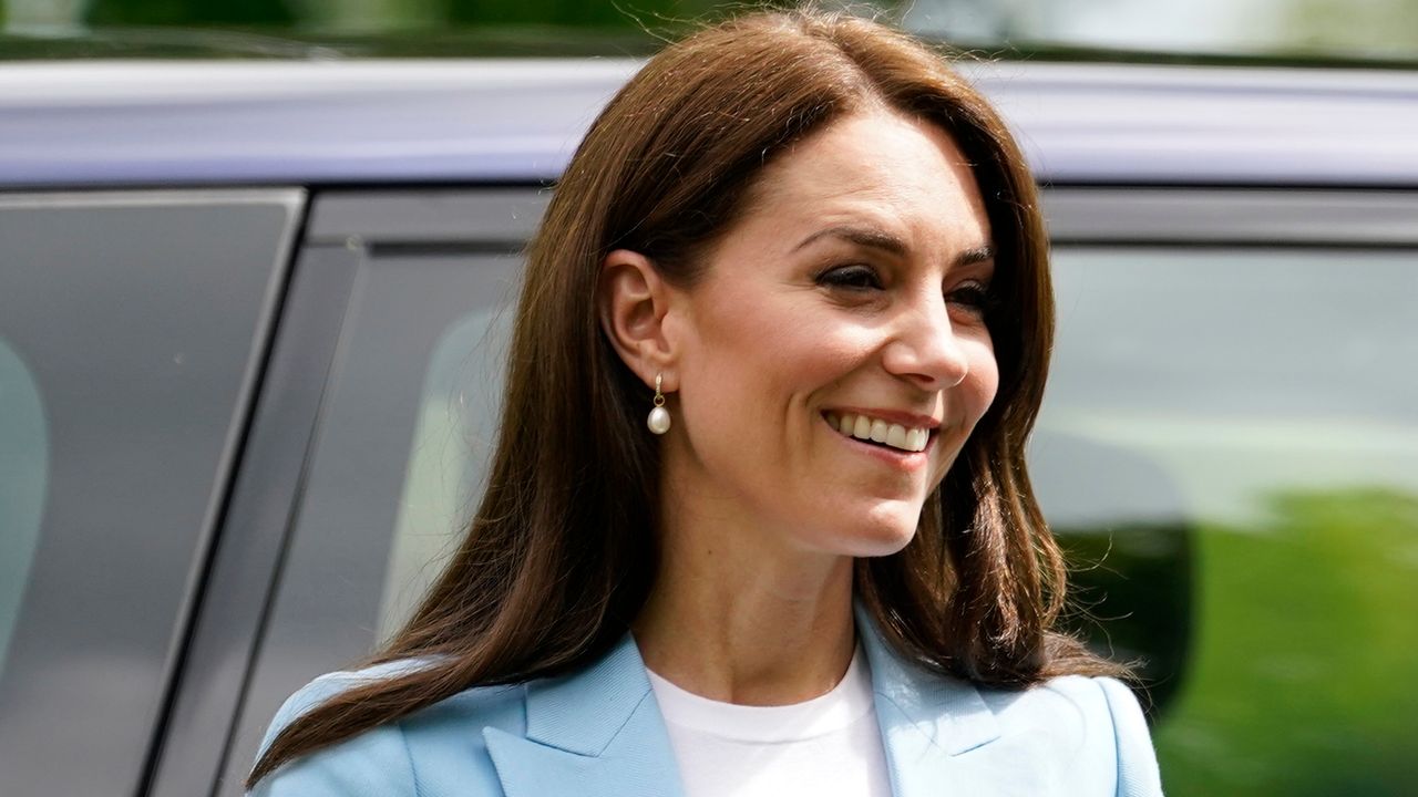 Kate Middleton&#039;s Reiss blazer, now reduced to £118, is seen as she smiles during a walkabout meeting members of the public on the Long Walk near Windsor Castle