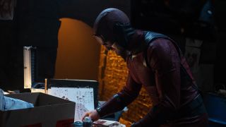 Daredevil looking through some documents in Daredevil: Born Again season 1