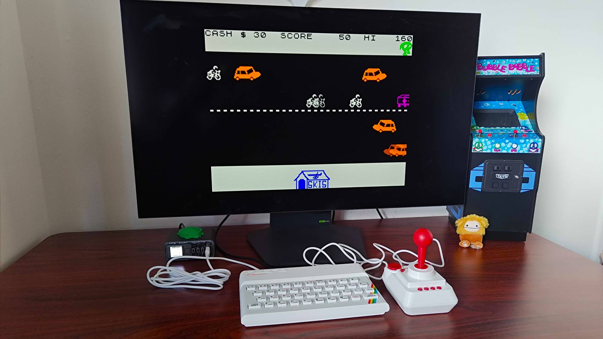 The Spectrum connected to LG OLED monitor with "Horace Goes Skiing" gameplay on screen.