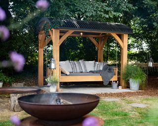 outdoor daybed by Blackdown Shepherd Huts and Sitting Spiritually with fire pit