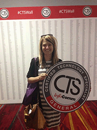 Kelly Perkins holding CTS certification placard