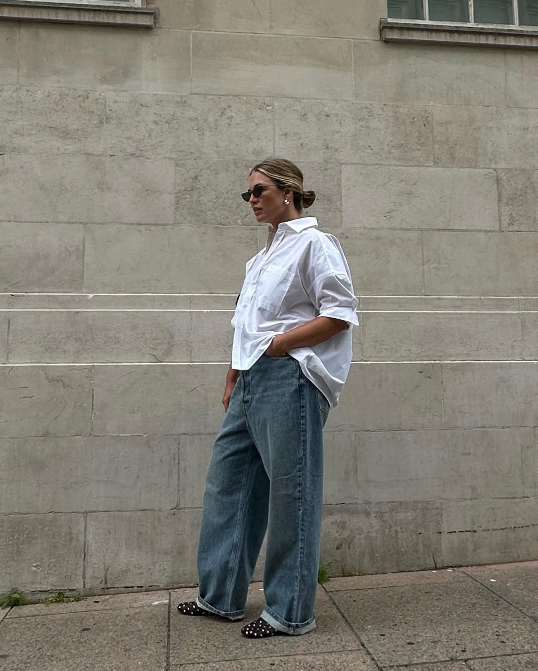 Alexis in jeans and white blouse with mesh shoes
