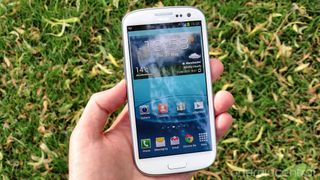 Samsung Galaxy S3 in-hand unlocked on the Home Screen