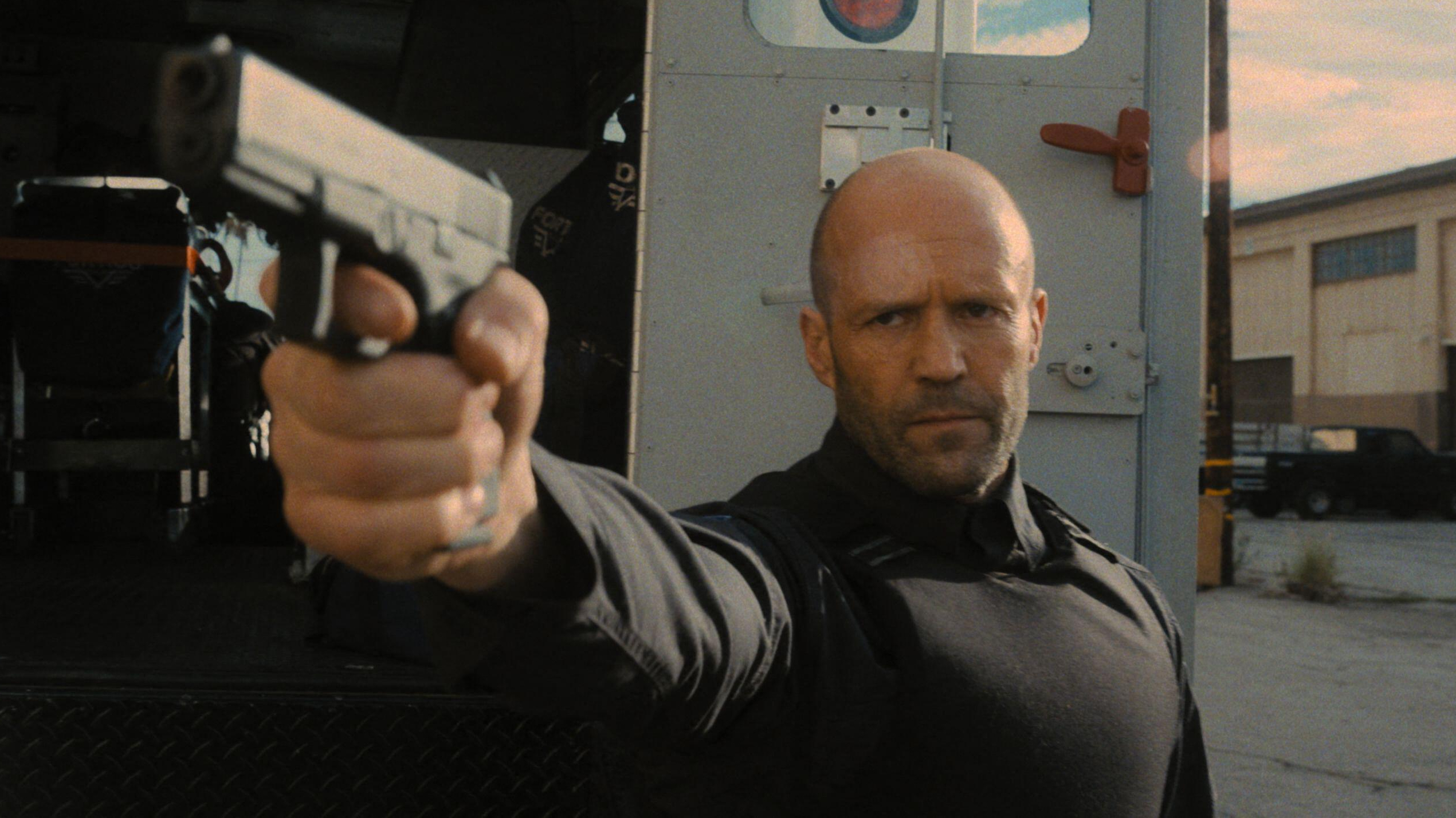 &amp;quot;H&amp;quot; (Jason Statham) readies a pistol in a scene from Guy Ritchie's &amp;quot;Wrath of Man&amp;quot;