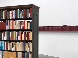 Books in bookcase: exhibition view of Theaster Gates show at the New Musuem