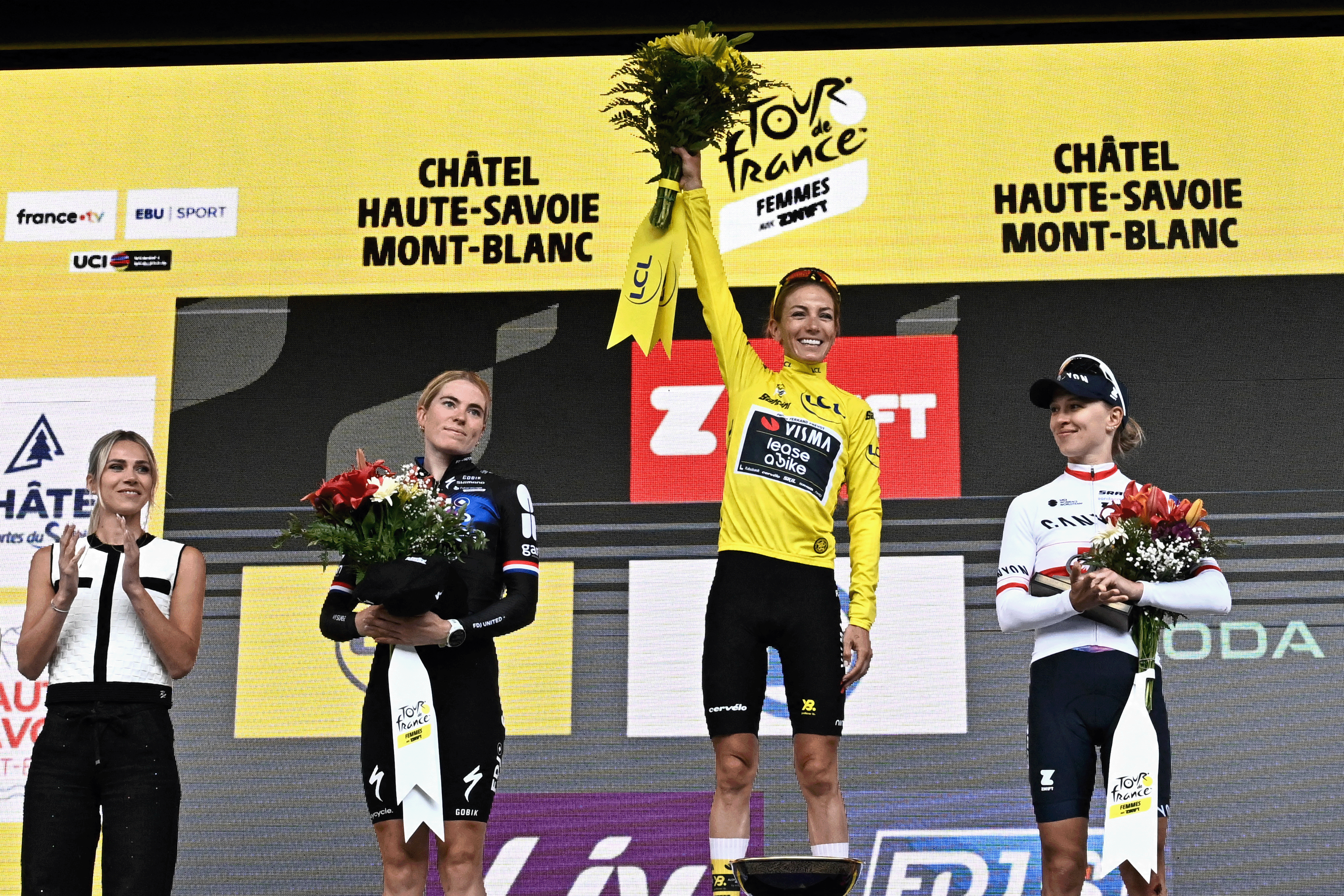 Second-placed FDJ-SUEZ team&#039;s Dutch rider Demi Vollering, winner Team Visma | Lease a Bike&#039;s French rider Pauline Ferrand-Prevot and third-placed Canyon//SRAM Racing team&#039;s Polish rider Katarzyna Niewiadoma celebrate on the podium for the fourth edition of the Women&#039;s Tour de France cycling race at the end of the 9th and final stage (out of 9) 124.1 km from Praz-sur-Arly to Chatel, in Chatel, eastern France on August 3, 2025. (Photo by JULIEN DE ROSA / AFP) (Photo by JULIEN DE ROSA/AFP via Getty Images)