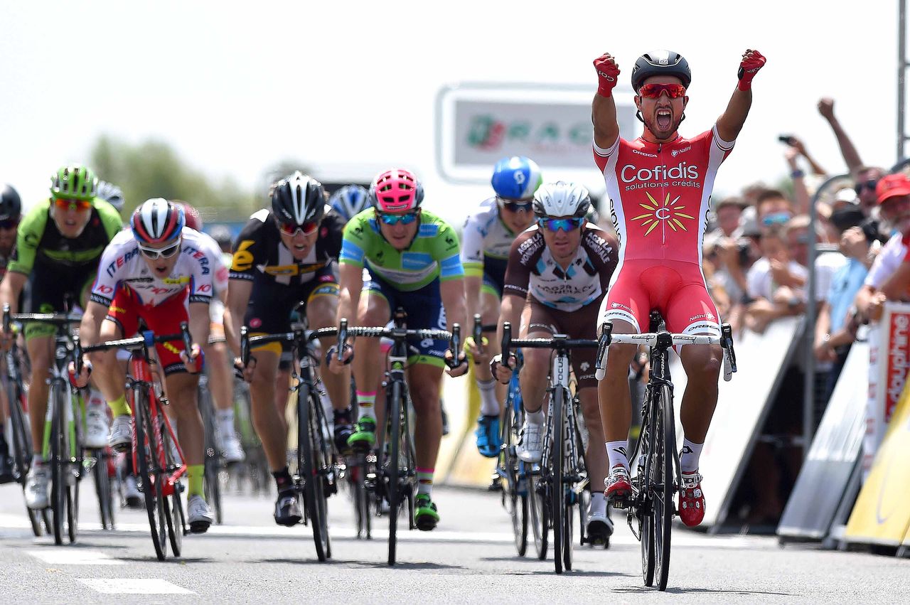 Nacer Bouhanni celebrates as he crosses the line
