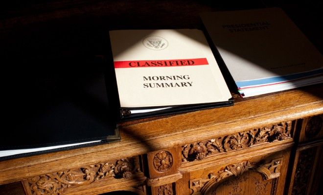 Classified information lies on the Resolute Desk in the Oval Office.