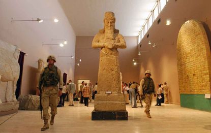 U.S. soldiers patrol the Iraq National Museum, which opened its doors July 3, 2003, for the first time since the April 2003 fall of Saddam Hussein in Baghdad, Iraq. The museum was plagued with weeks of looting that also sacked the museum. 