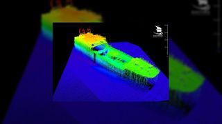 A 3D blue, green, yellow and orange image of the Montevideo Maru on the seafloor.