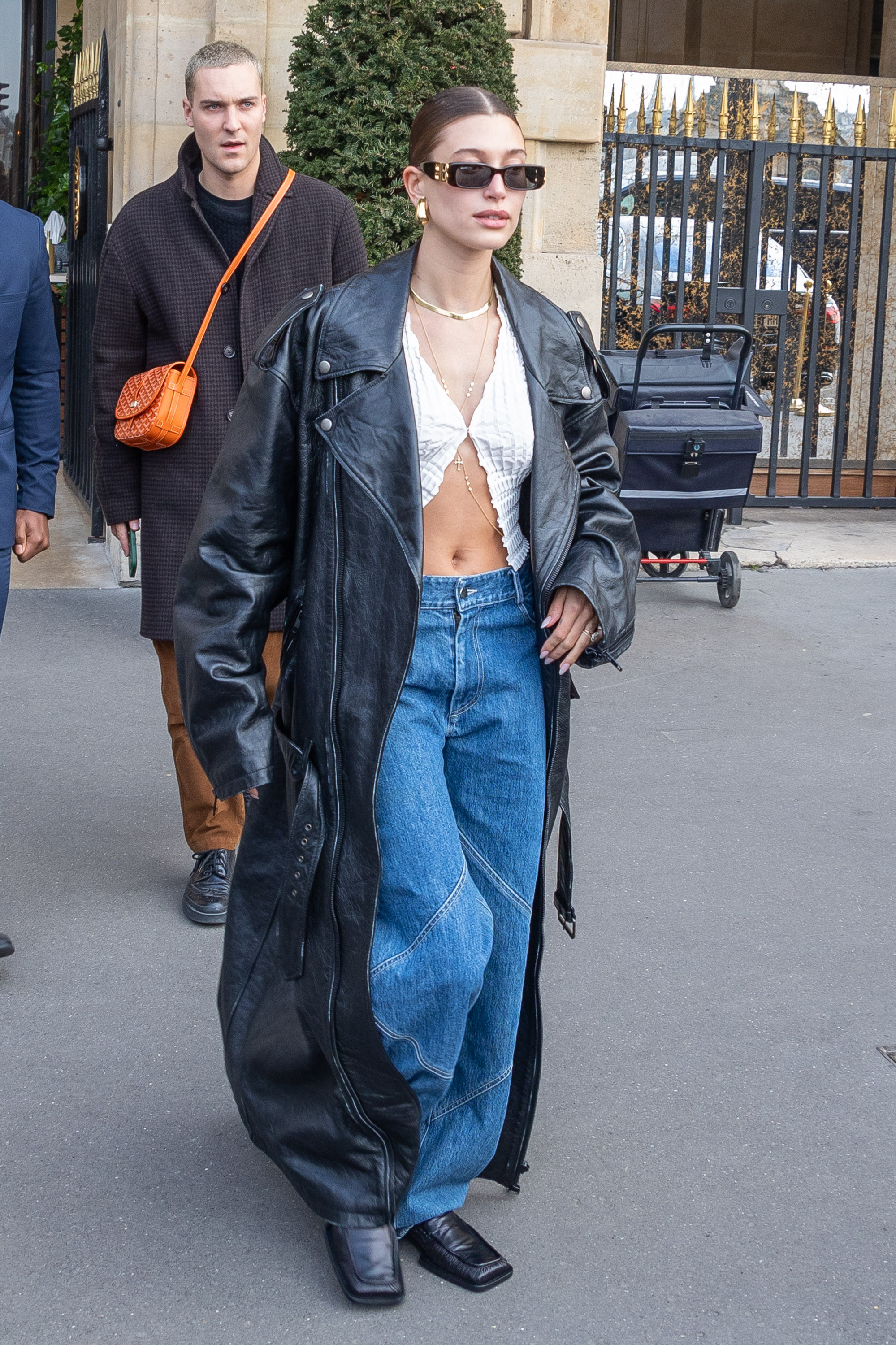 Hailey Bieber was spotted in Paris wearing her favorite Jil Sander loafers, baggy jeans, and an oversized leather trench coat from Balenciaga.