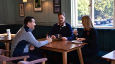 Golfers chatting in clubhouse