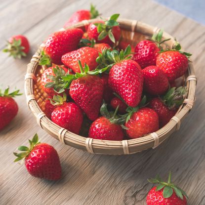 bowl full of fresh ripe red strawberries 