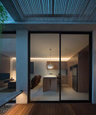 outside looking in at sculptural jakarta house by Isso Architects