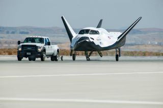 The private Dream Chaser space plane undergoes a 60 mph tow test at NASA's Dryden Flight Research Center in California in May 2013 ahead of planned unmanned flight tests.