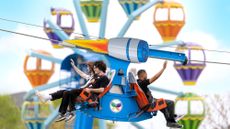 People ride a zipline at Morgan's Wonderland