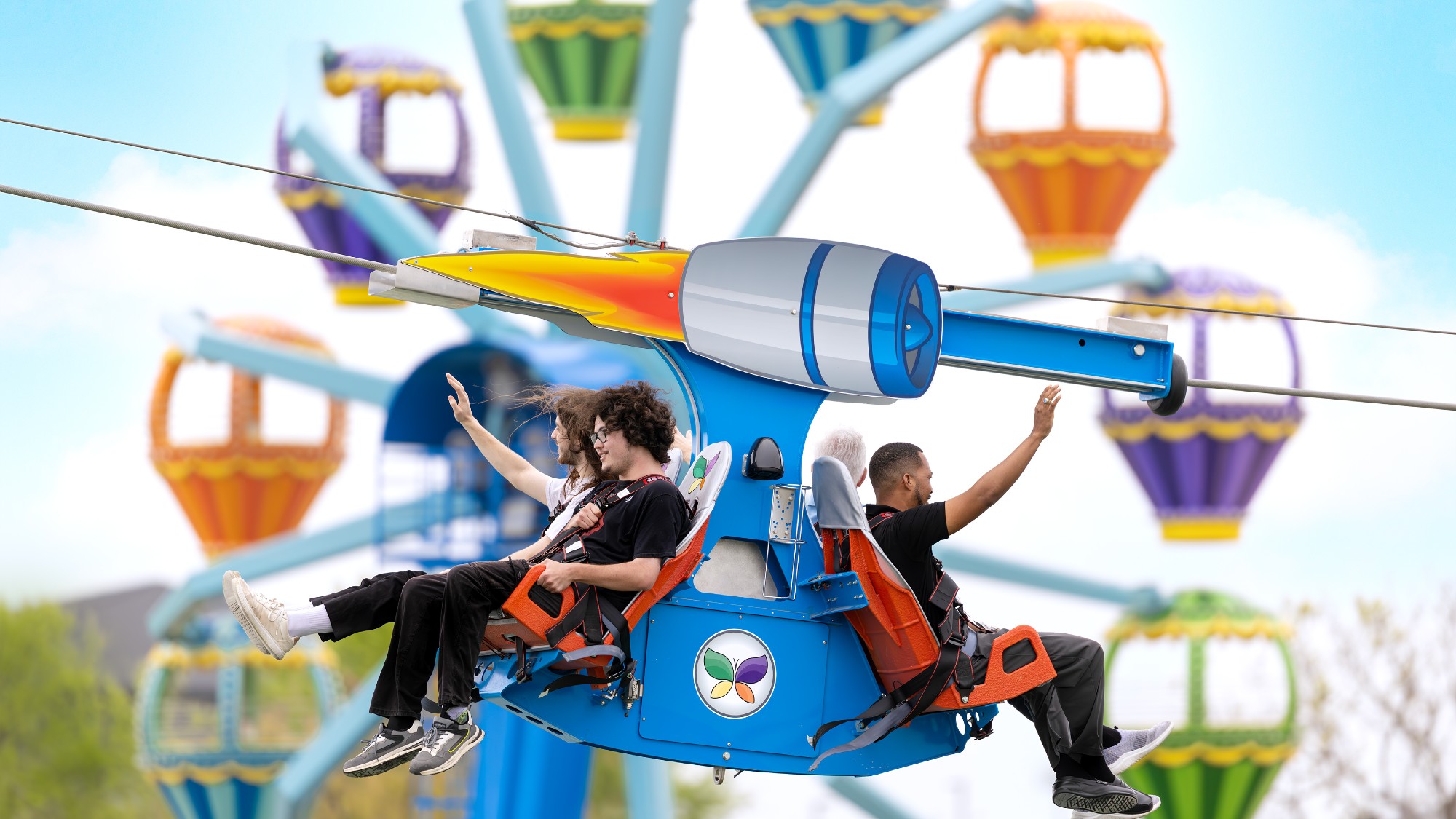 People ride a zipline at Morgan's Wonderland