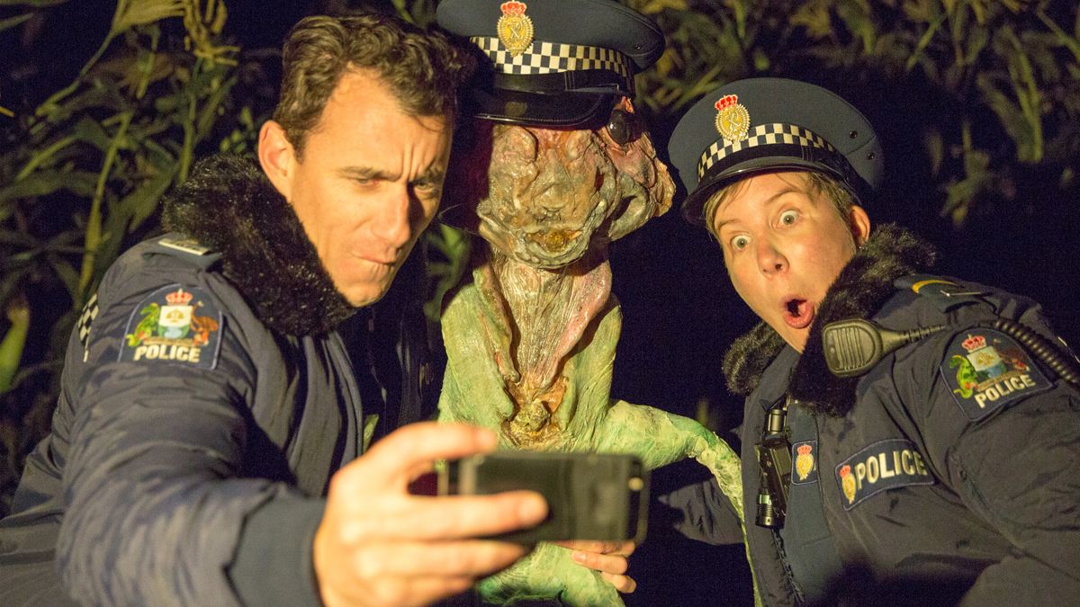 Wellington Paranormal&#039;s officers Minogue and O&#039;Leary pose with an alien. 