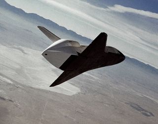 The space shuttle prototype Enterprise flies free after being released from NASA's 747 Shuttle Carrier Aircraft over Rogers Dry Lakebed during the second of five free flights carried out at the Dryden Flight Research Center, in Edwards, Calif., as part of