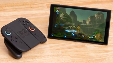 A Nintendo Switch 2 in standalone mode sitting next to the Joy-Con controller grip