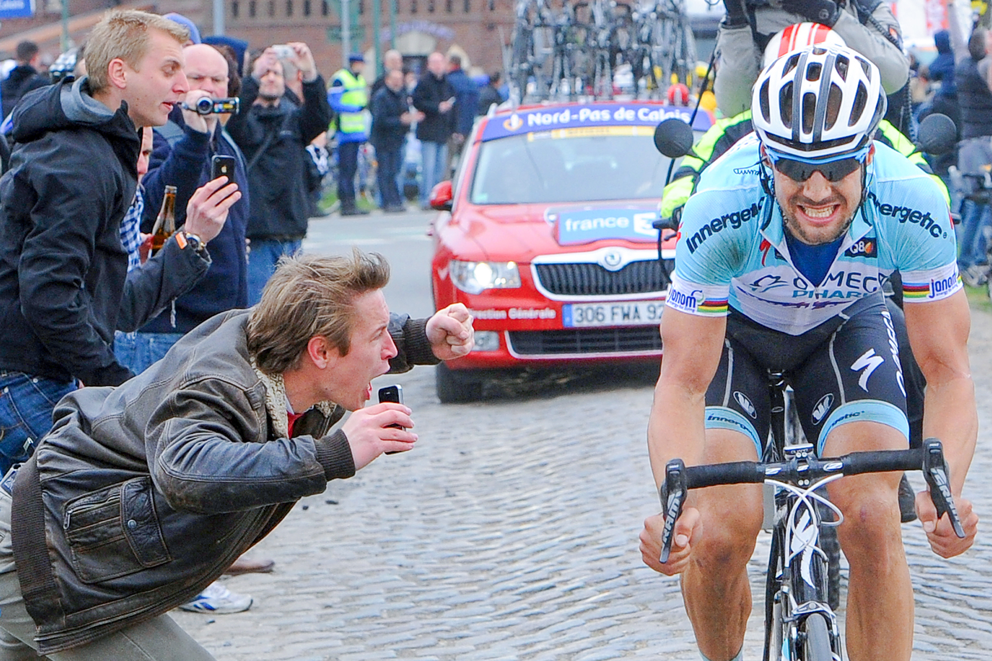 Tom Boonen is cheered on by fans as he races to solo victory at the 2012 Paris-Roubaix
