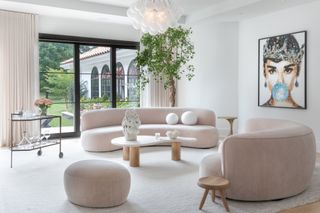 A living room characterized by pale pinks