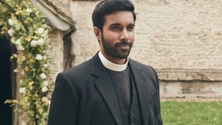 Reverend Alphy Kottaram (played by Rishi Nair). DI Geordie Keating (Robson Green), the other half of the vicar-detective team, not pictured.