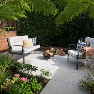 garden area with white marble flooring with sofa