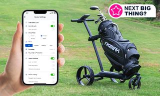 A hand holding a phone next to an AI-powered golf cart