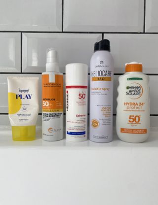 Original image showing five water resistant sunscreens featured in this guide from Supergoop, La-Roche Posay, Ultrasun, Heliocare and Garnier