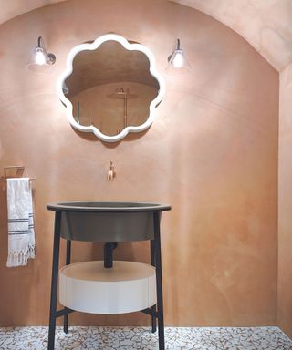 Pink stone effect bathroom wall and ceiling, tile floor