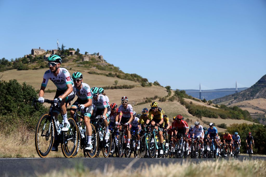 The pack rides with the Millau viaduct in the background during the 7th stage of the 107th edition of the Tour de France cycling race 168 km between Millau and Lavaur on September 4 2020 Photo by Kenzo Tribouillard AFP Photo by KENZO TRIBOUILLARDAFP via Getty Images