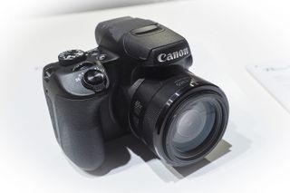 Canon Powershot SX70 HS camera on a white background