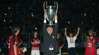 Carlo Ancelotti holds the Champions League trophy, May 2003