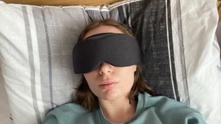 The tester using the Aura sleep mask while lying on their back