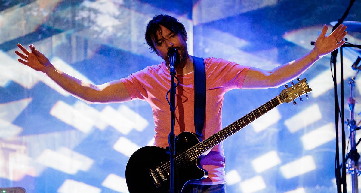 Bruce Soord of the Pineapple Thief onstage in Italy, playing a single-cut electric guitar