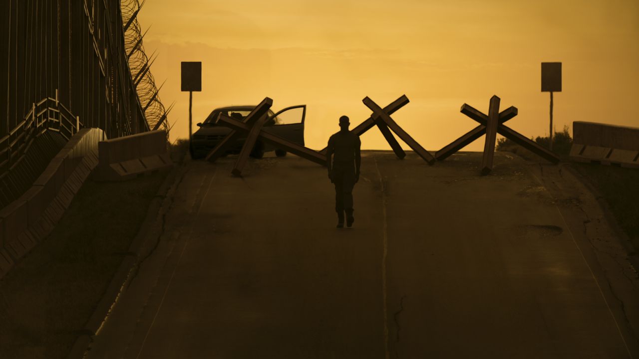 Damson Idris walks into the sunset in "Outside the Wire" on Netflix.