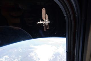 This image of the International Space Station was taken by Atlantis' STS-135 crew during a fly around as the shuttle departed the station on Tuesday, July 19, 2011, FLight Day 12. STS-135 is the final shuttle mission to the orbital laboratory.