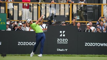 Collin Morikawa hits his tee shot on the 18th hole during the third round of the ZOZO Championship at Accordia Golf Narashino Country Club