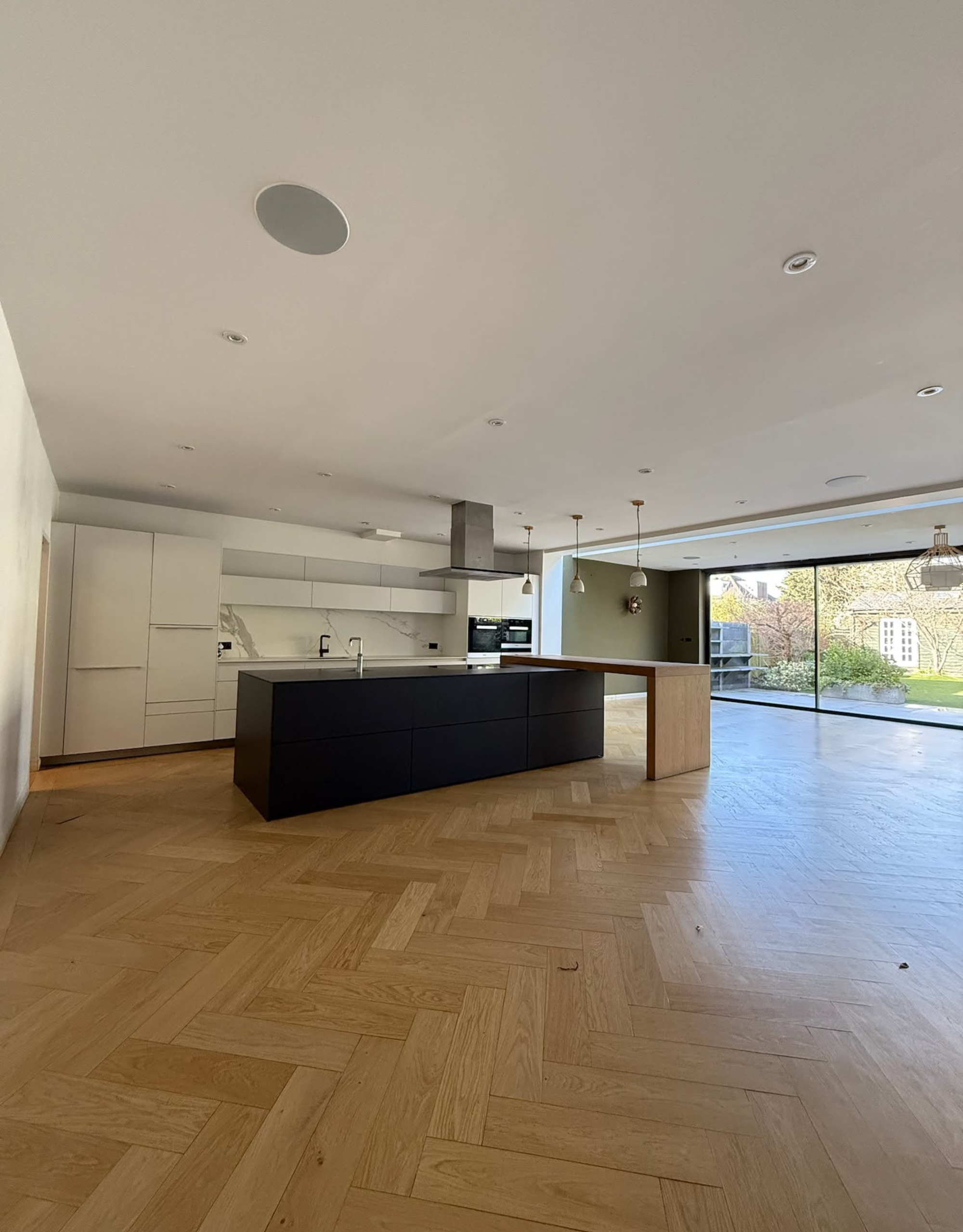 A modern, soulless kitchen transformed into a tradition, dark wooden design