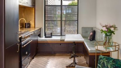 a small kitchen with built-in seating