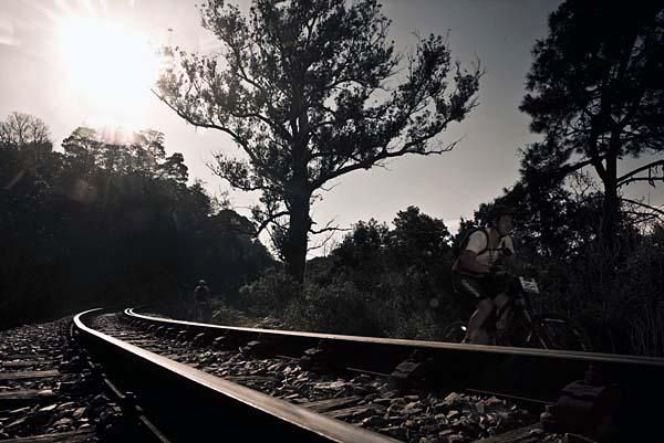 Riding by the tracks.